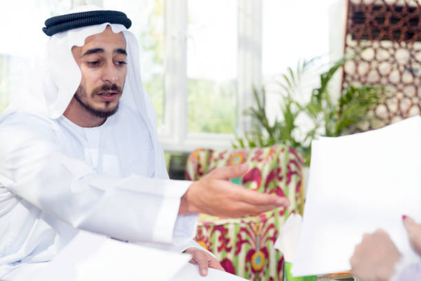 A person using a computer to check tenancy contract online in Abu Dhabi